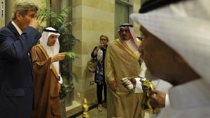 US Secretary of State John Kerry (L) drinks tea with Saudi Arabia's Foreign Minister Adel al-Jubeir (2L) upon his arrival at the King Abdulaziz International airport in Jeddah, on August 24, 2016.  Kerry arrived in Saudi Arabia to push for peace in Yemen after UN-brokered talks collapsed despite global concern over mounting civilian casualties.  / AFP / STRINGER / Saudi Arabia OUT        (Photo credit should read STRINGER/AFP/Getty Images)